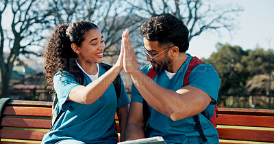 Buy stock photo Education, high five and success with medical students on campus bench for celebration or motivation. Healthcare, internship or residency with friends outdoor for development or learning goals
