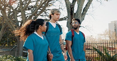 Buy stock photo Medical student, group and walk at campus, talk and ready for education, class and outdoor at college. People, men and woman with friends, chat and scholarship for learning healthcare at university
