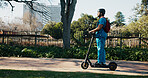 Man, medical student and scooter at campus, travel and outdoor with backpack, helmet and ride to class. Person, electric vehicle and transport to university for education, development or learning