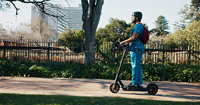 Buy stock photo Man, medical student and scooter at campus, travel and outdoor with backpack, helmet and ride to class. Person, electric vehicle and transport to university for education, development or learning