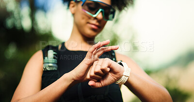 Buy stock photo Fitness, running and watch with woman in forest for challenge, performance or progress tracking. Exercise, marathon and time with athlete or runner outdoor in nature for training or workout routine