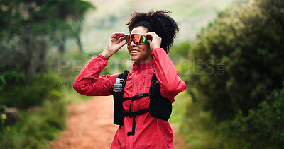 Buy stock photo Exercise, sunglasses and thinking with woman in forest for break, performance or trail running. Fitness, planning and smile of happy athlete or runner outdoor in nature for challenge, hiking or hobby