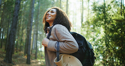 Buy stock photo Thinking, hiking and happy woman in woods for adventure, eco tourism or holiday in nature. Vacation, backpacking and African person in forest for outdoor trip, travel and reflection for exploration