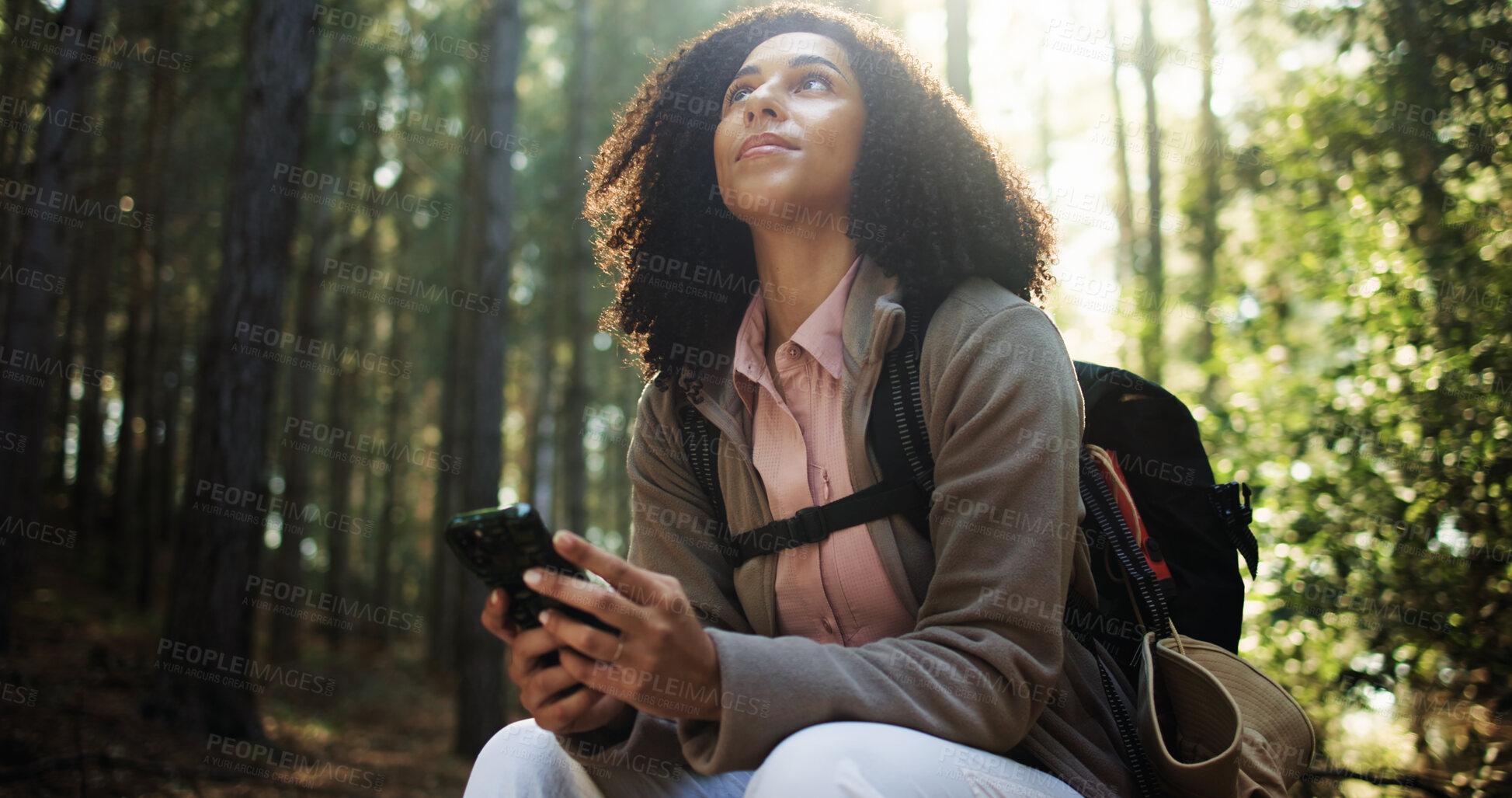 Buy stock photo Hiking break, thinking or woman with phone in forest for direction search, travel rest or map guide. Trekking, hiker and smartphone with low angle in woods for navigation, journey reflection and view