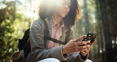 Buy stock photo Woods, hiking and woman in nature with phone, online navigation tech and outdoor adventure. Technology, trekking or female person in forest with flare, internet connection or mobile app for location