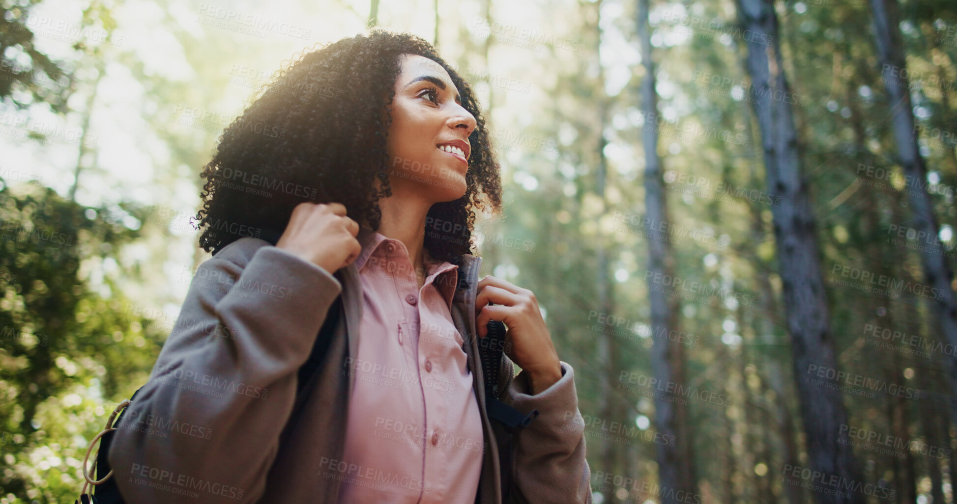 Buy stock photo Happy woman, forest and hiking with backpack for adventure or explore outdoor wilderness. Female person, hiker or smile with bag, sunshine or trees in nature for trekking journey or travel in woods