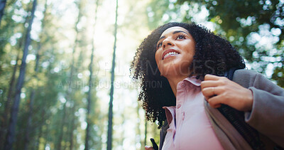 Buy stock photo Thinking, woman and hiking with smile in nature for travel, adventure ideas and holiday reflection. Below, female person and thoughts for trekking vision, backpacking choice and sightseeing in forest