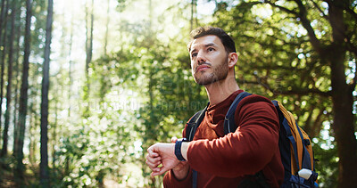 Buy stock photo Man, watch and hiking with backpack in forest for tracking path, time or step counter in nature. Male person, hiker or traveler with wristwatch or bag in wilderness for trekking adventure or journey