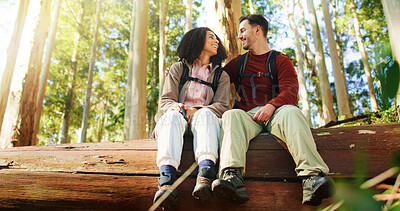 Buy stock photo Hug, hikers and couple in nature, love and break on adventure, forest and relax on holiday or laugh. Outdoor, man and embrace with woman in woods, backpacker or romance on vacation and low angle
