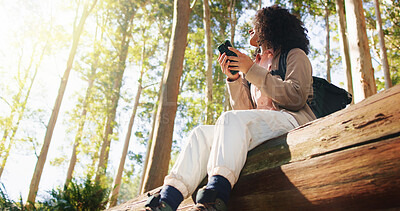 Buy stock photo Woman, phone and happy for hiking in forest for search, direction or low angle on summer vacation. Person, smartphone and smile for reflection, mobile app and digital map with trekking in Brazil