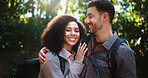 Happy, hikers and couple in nature, portrait or hug on adventure, love and break on holiday or trip. Outdoor, people and bonding on journey, backpacking and smile on vacation, traveller and woods