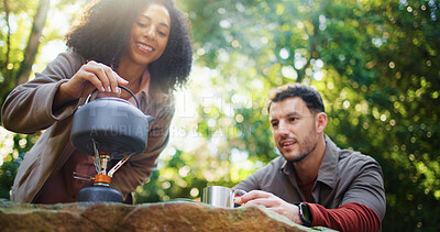Buy stock photo Camping, kettle and relax with couple in nature for travel destination, coffee break and boiling water. Bonding, brewing tea and gas stove with man and woman in forest for trekking adventure