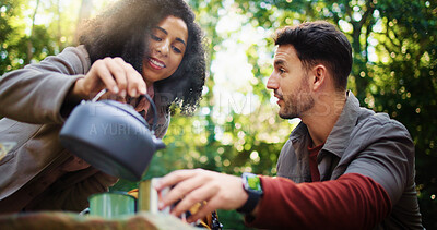 Buy stock photo Camping, kettle and help with couple in nature for travel destination, coffee break and boiling water. Bonding, brewing tea and smile with man and woman in forest for trekking adventure and vacation