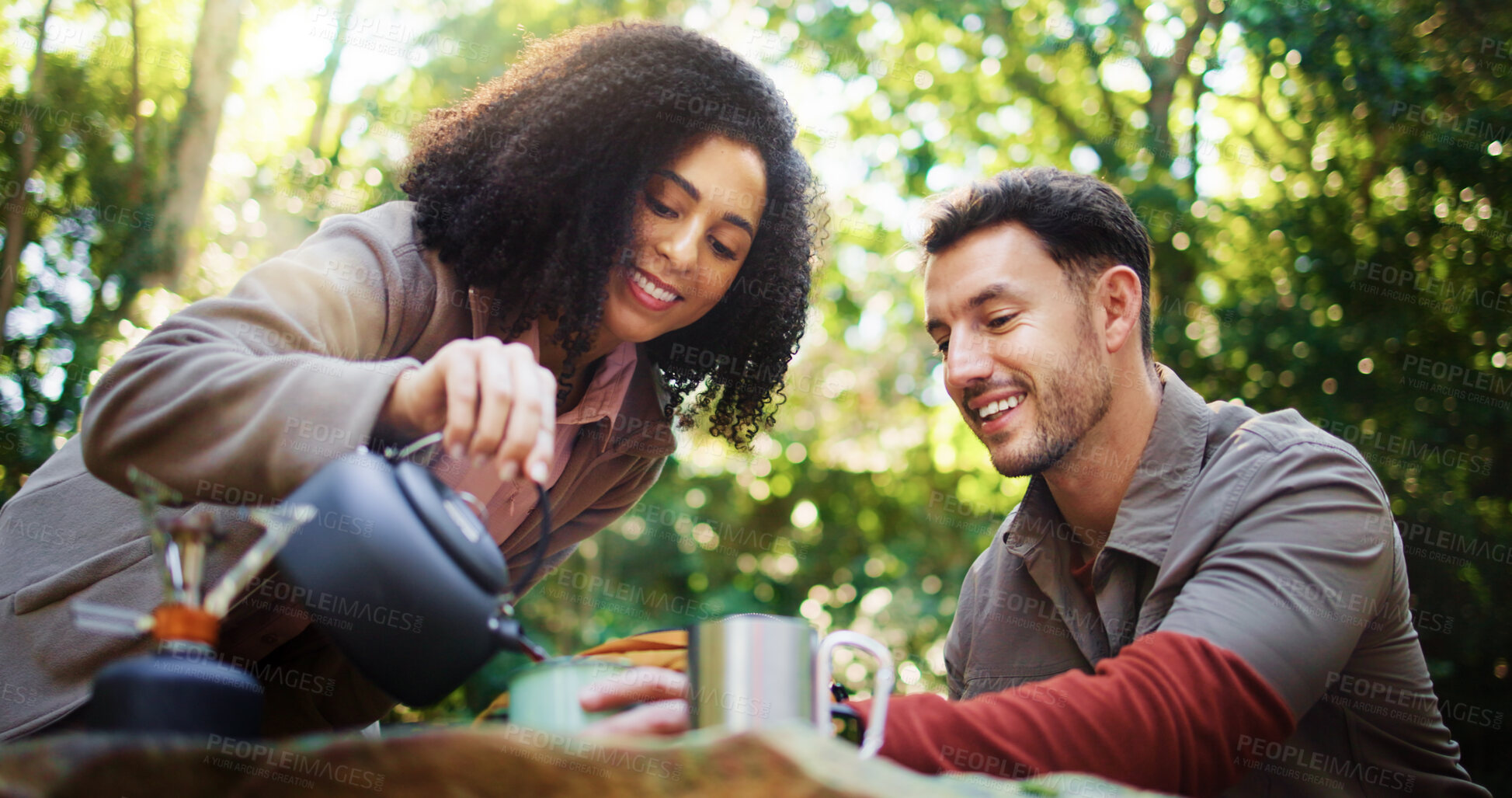 Buy stock photo Camping, kettle and pour with couple in nature for travel destination, coffee break and boiling water. Bonding, brewing tea and help with man and woman in forest for trekking adventure and vacation