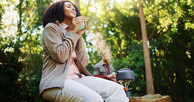 Buy stock photo Happy, woman and coffee in woods for trekking adventure, happiness and traveling holiday in nature. Hiking, view scenery and people with hot drink for vacation, reflection and relax in Madagascar