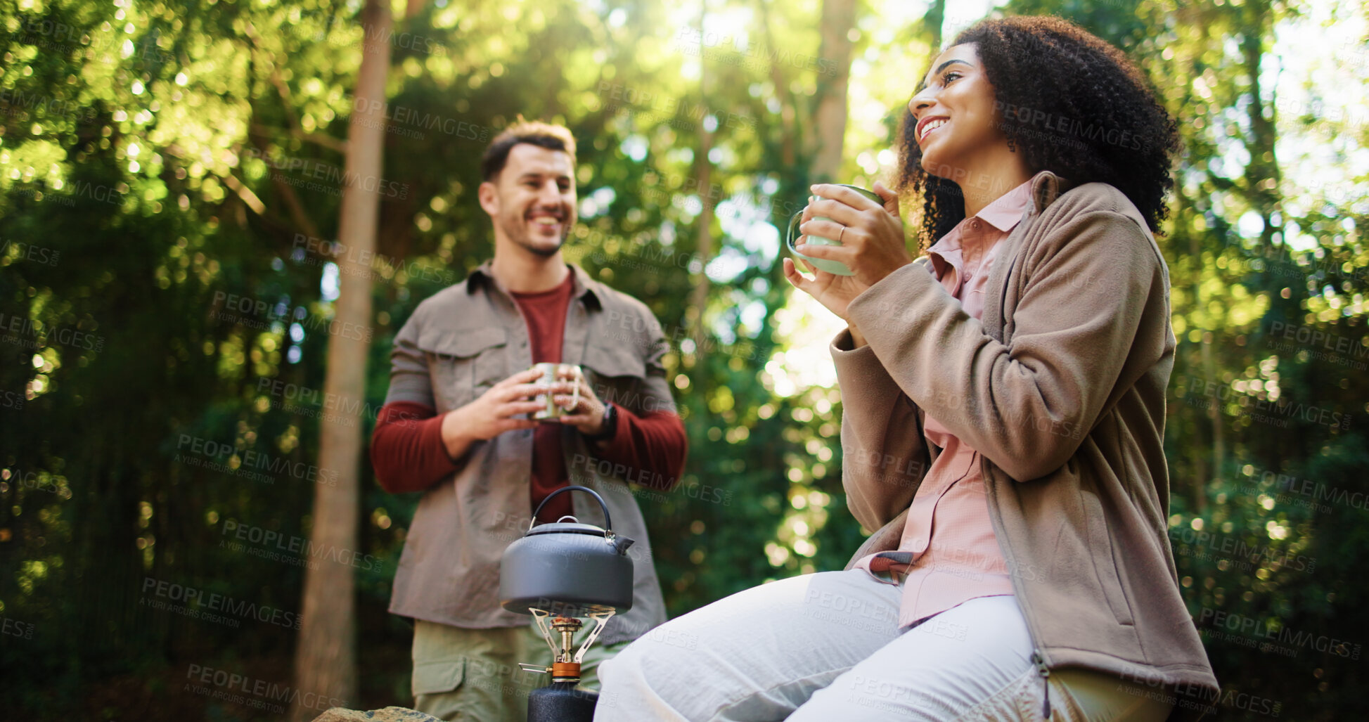 Buy stock photo Happy couple, hiking or relax in forest for coffee break, camping adventure or holiday in nature. Weekend travel, morning chat or people in woods for romantic getaway, bonding or breakfast together