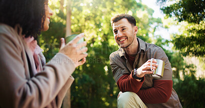 Buy stock photo Couple, hiking and coffee break in forest with talk, rest and bonding on tourism adventure in summer. Happy man, woman and interracial love, tea cup or conversation on holiday for trekking in woods