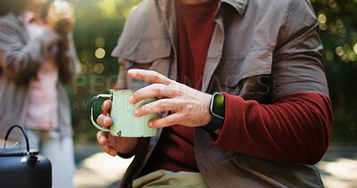 Buy stock photo Hands, cup and coffee in forest, camp and rest on hiking trip with partner, outdoor and nature tourism. Person, couple and kettle for tea, drink or warm beverage with break for trekking in woods