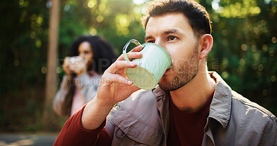 Buy stock photo Man, drinking coffee and hiking in forest with partner, rest and outdoor with reflection for nature tourism. Person, couple and memory with tea, thinking or beverage with break for trekking in woods