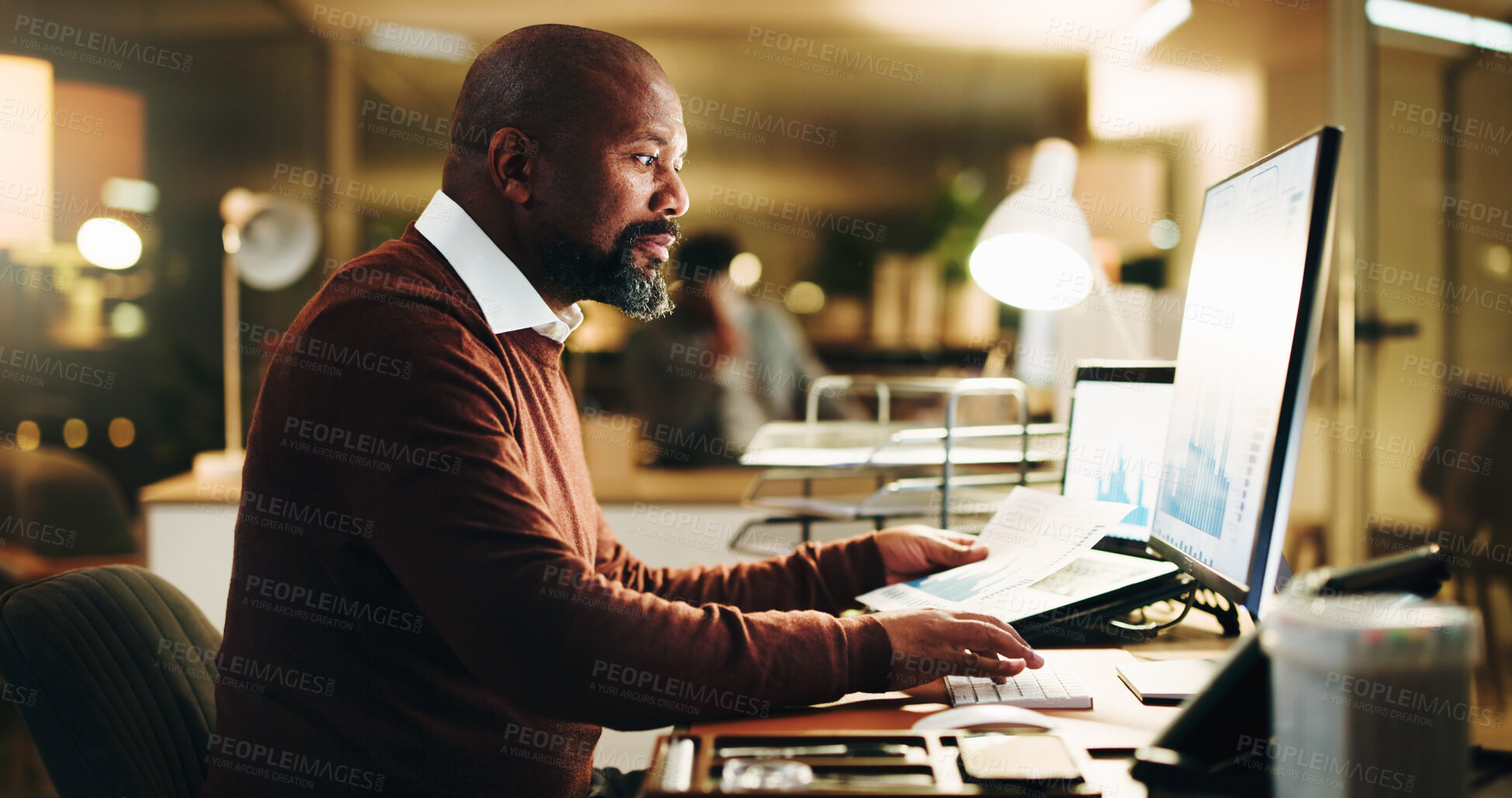 Buy stock photo Computer screen, finance and reading with business black man in office at night for investment. Data, display and report with mature portfolio manager at work for evening review of charts or graphs