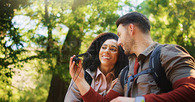 Buy stock photo Hiking, binoculars and smile with couple in nature for bird watching, trekking adventure and bonding. Backpacking date, sightseeing and travel vacation with man and woman in forest for love and hobby