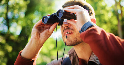 Buy stock photo Explore, hike and man in forest with binocular, bird watching or sightseeing in holiday hobby. Observation, nature and tourist in woods with field glasses, outdoor or animal search on solo trip.
