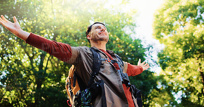 Buy stock photo Happy man, freedom and hiking in forest with achievement, goals and stretching arms in nature. Person, smile and excited in woods with success for trekking adventure with low angle in Australia