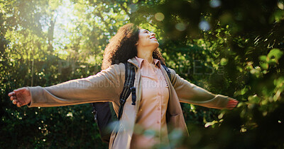 Buy stock photo Woman, happy or freedom in forest with smile, sunshine or inner peace on hiking adventure. Bokeh, person outdoor or sunlight flare in woods with reflection, positive or wellness on summer break.