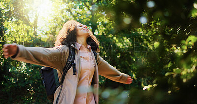 Buy stock photo Woman, outdoor nature or freedom in forest with outstretched arms, sunshine or inner peace for adventure. Happy, person bokeh or sunlight in woods with space, positive or wellness for summer break.