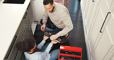 Buy stock photo Child, help and father with tools at house for plumbing, repair sink and support for maintenance. Above, girl and man with wrench to fix leak, unclog drain and diy installation for bonding together