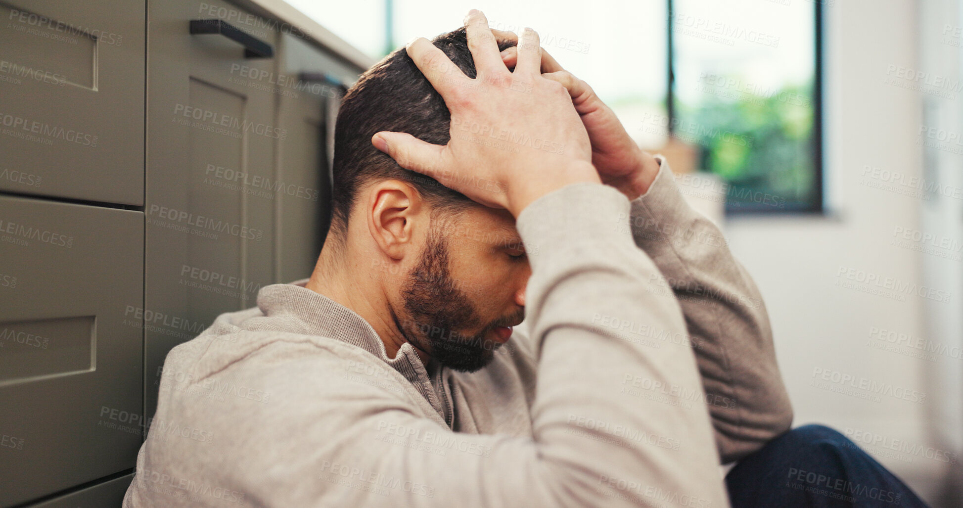 Buy stock photo Depression, stress and man in kitchen with headache, mental health challenge or think of debt. Home, migraine and sad person with anxiety for financial crisis, bankruptcy reflection or regret mistake
