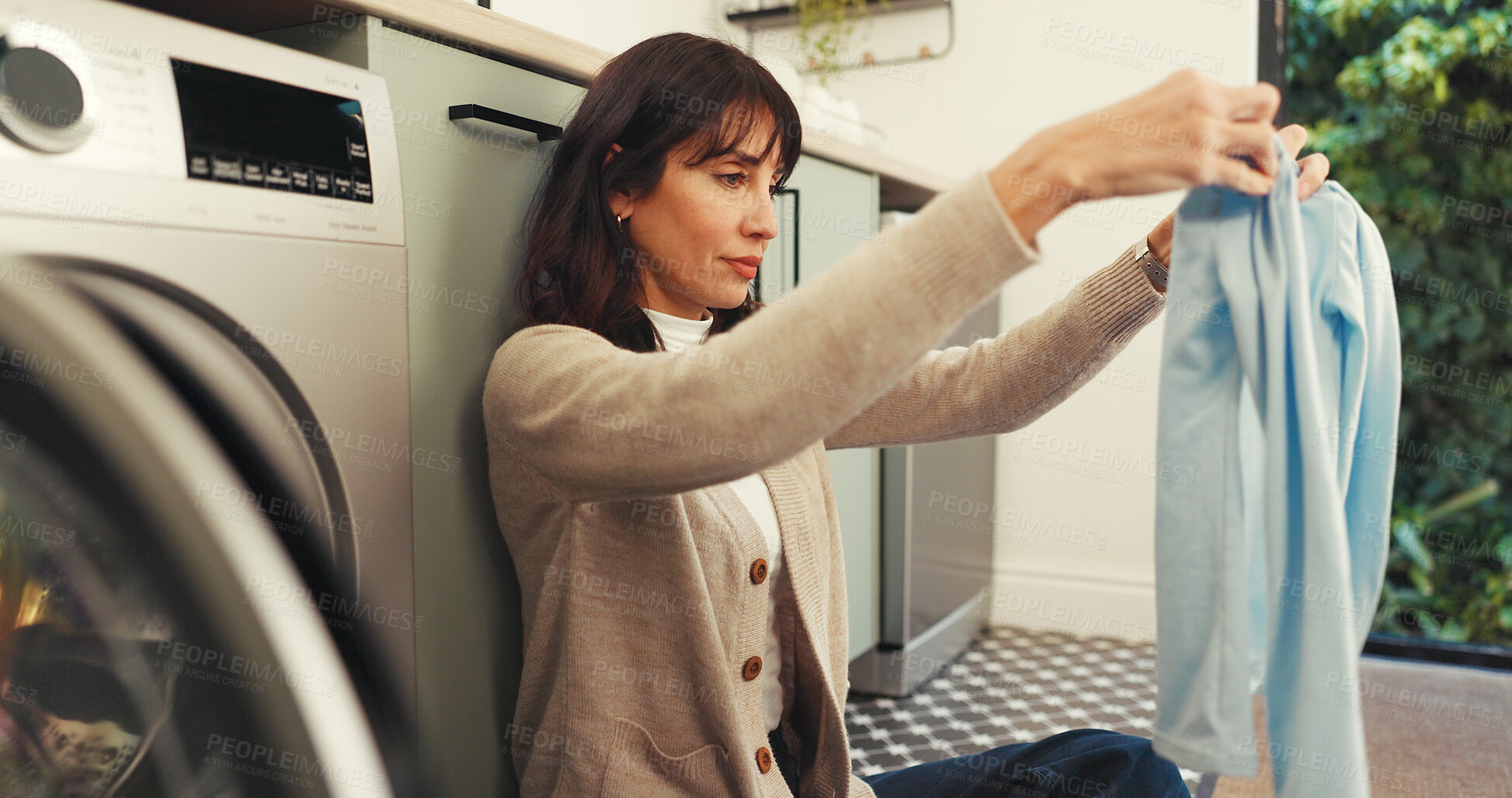 Buy stock photo Packing, laundry and clothes with woman and washing machine for cleaning, hygiene and tidy. Housekeeping, folding and sanitary chores with person in washroom of home for basket, dryer and fabric