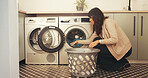 Woman, laundry and washing machine for cleaning in home with basket, fabric and routine for hygiene. Person, container and appliance with clothes, linen or chores with housekeeping at apartment