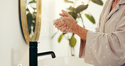 Buy stock photo Basin, hygiene and washing hands with woman in bathroom of home for morning skincare routine. Cleaning, protection and soap with person closeup in apartment to remove bacteria, dirt or germs