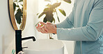 Washing hands, home and man in bathroom, wellness and hygiene with faucet, rinse and bacteria. Apartment, germ prevention and person with tap, disinfection and cleaning with virus removal and sink