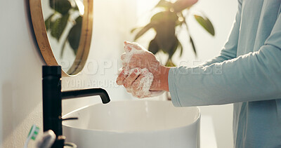 Buy stock photo Basin, hygiene and washing hands with person in bathroom of home for morning routine or skincare. Cleaning, protection and soap with man closeup in apartment to remove bacteria, dirt or germs