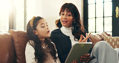 Buy stock photo Mother, girl and tablet on sofa for learning, talk and guide for childhood literacy with online course. Woman, mom and kid with tech, reading or teaching with education app on couch in family house