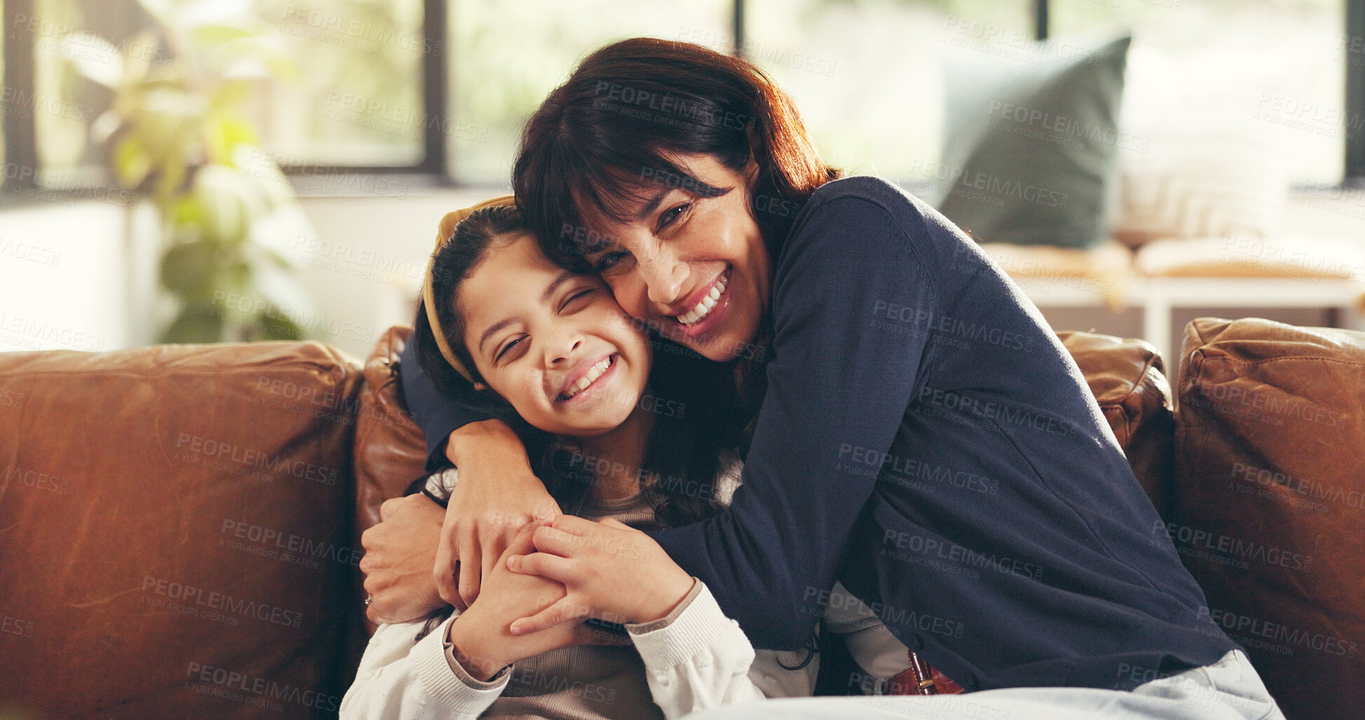 Buy stock photo Portrait, home and mother with girl, hug and bonding together with happiness, care and comfort. Apartment, family and mama on couch, child and relationship with embrace, love and relax in living room