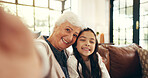 Smile, selfie and grandmother with child on sofa in family home for memory, bonding and profile picture. Happiness, photography and relax with old woman and kid in living room for love, hug and care
