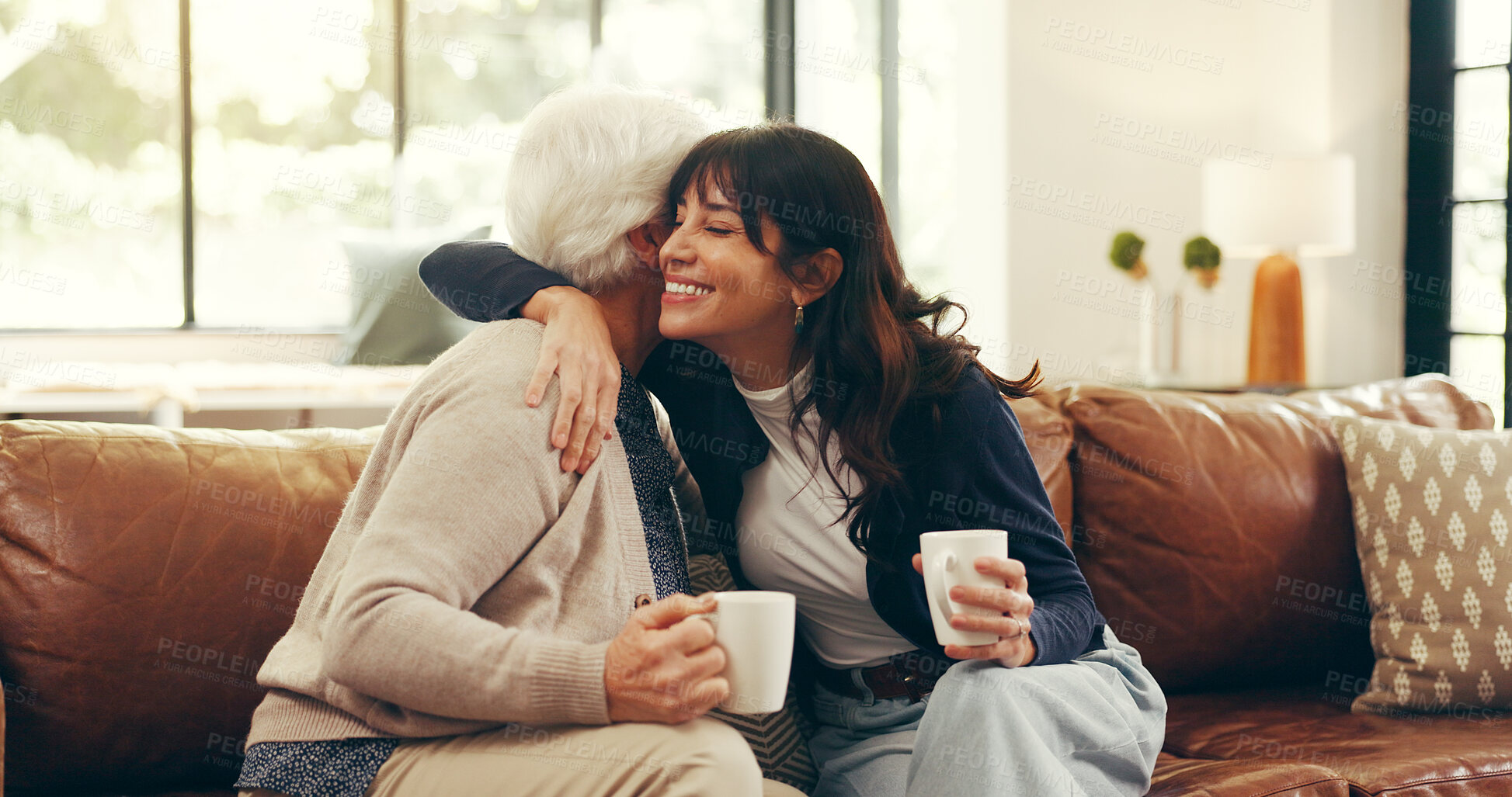 Buy stock photo Relax, coffee and hug with senior mother and daughter on sofa for love, bonding or support. Retirement, care and drinking tea with women in living room of family home for trust, connection or embrace