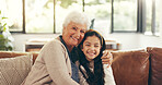 Portrait, home and grandmother with girl, hug and bonding together, smile, care and relax in lounge. Apartment, family and granny on couch, child and relationship with embrace, love and happiness