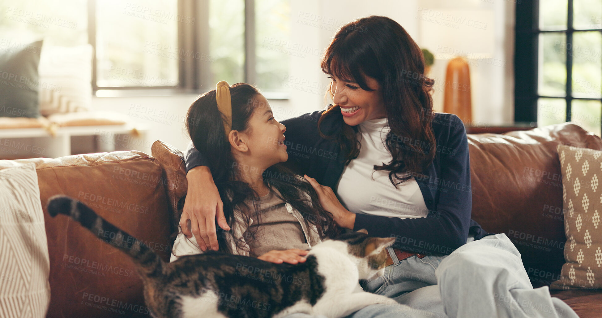 Buy stock photo Cat, hug or love with mother and daughter on sofa in living room of home together for bonding. Break, relax or smile with girl child, pet and single parent woman in apartment for weekend wellness
