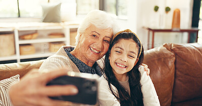 Buy stock photo Relax, selfie and grandmother with child on sofa in family home for memory, bonding and profile picture. Happiness, photography and smile with old woman and kid in living room for love, hug and care