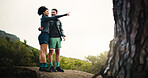 Hiking, pointing and fitness with couple in nature for trekking adventure health journey and support. Sightseeing, environment and explore with man and woman on path outdoor for bonding and workout