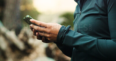 Buy stock photo Outdoor, hands and woman with smartphone, hiking and digital app for location. Hiker, forest and person with cellphone, social media and internet for direction, connection and message to contact