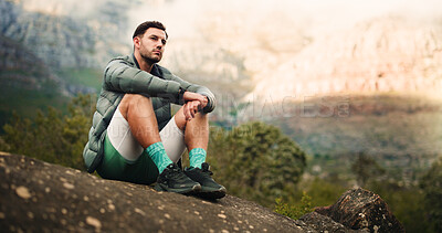Buy stock photo Thinking, rest and man on rock for hiking, outdoor adventure and exercise on mountain. Fitness, space and person on break, relax and thoughtful in nature for fresh air, wellness and sightseeing
