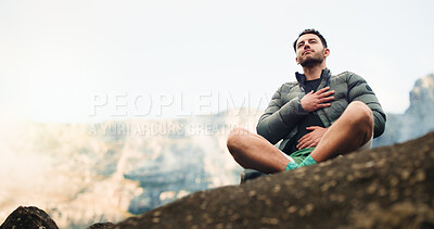 Buy stock photo Breathing, outdoor and man with fitness, relax and tired with heart health, calm and chakra. Space, person and hiker with break, peaceful and fatigue with workout, balance and nature in Canada