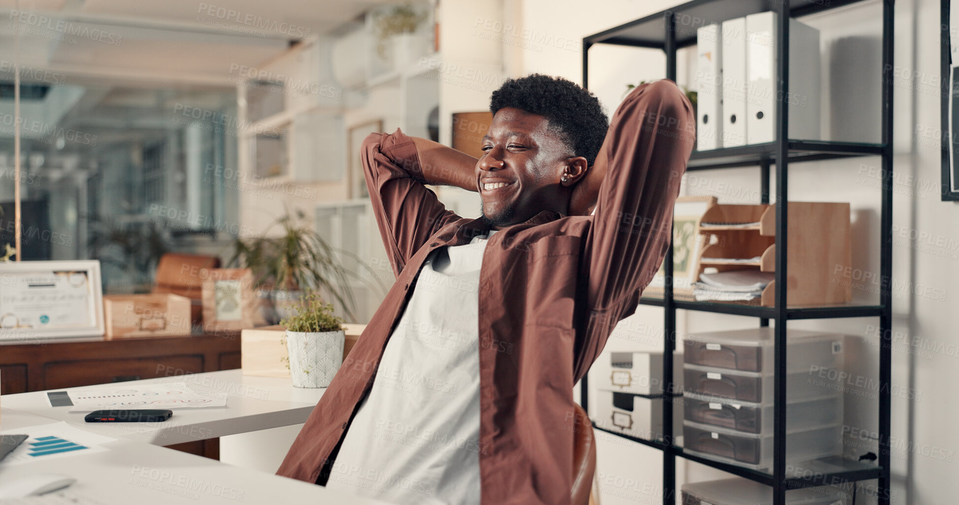 Buy stock photo Happy, black man or stretching with completion for done, productivity or deadline success in office. Male person, relax or administrator with smile or break for finished tasks or company agenda