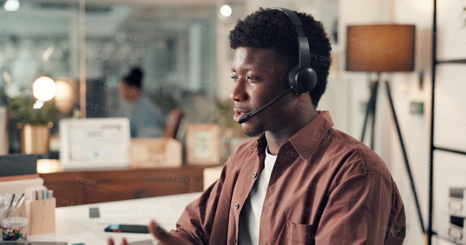 Buy stock photo Businessman, consultant and night with headset for customer service or online advice in office. Male person, agent or advisor working late with mic for virtual assistance, tech help or communication
