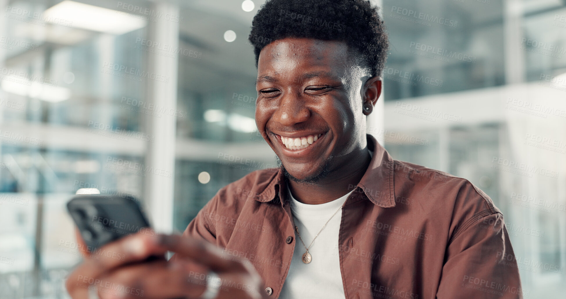 Buy stock photo Phone, happy and black man in office with networking, communication or contact on mobile app. Smile, technology and African male creative director with chatting online with cellphone in workplace.